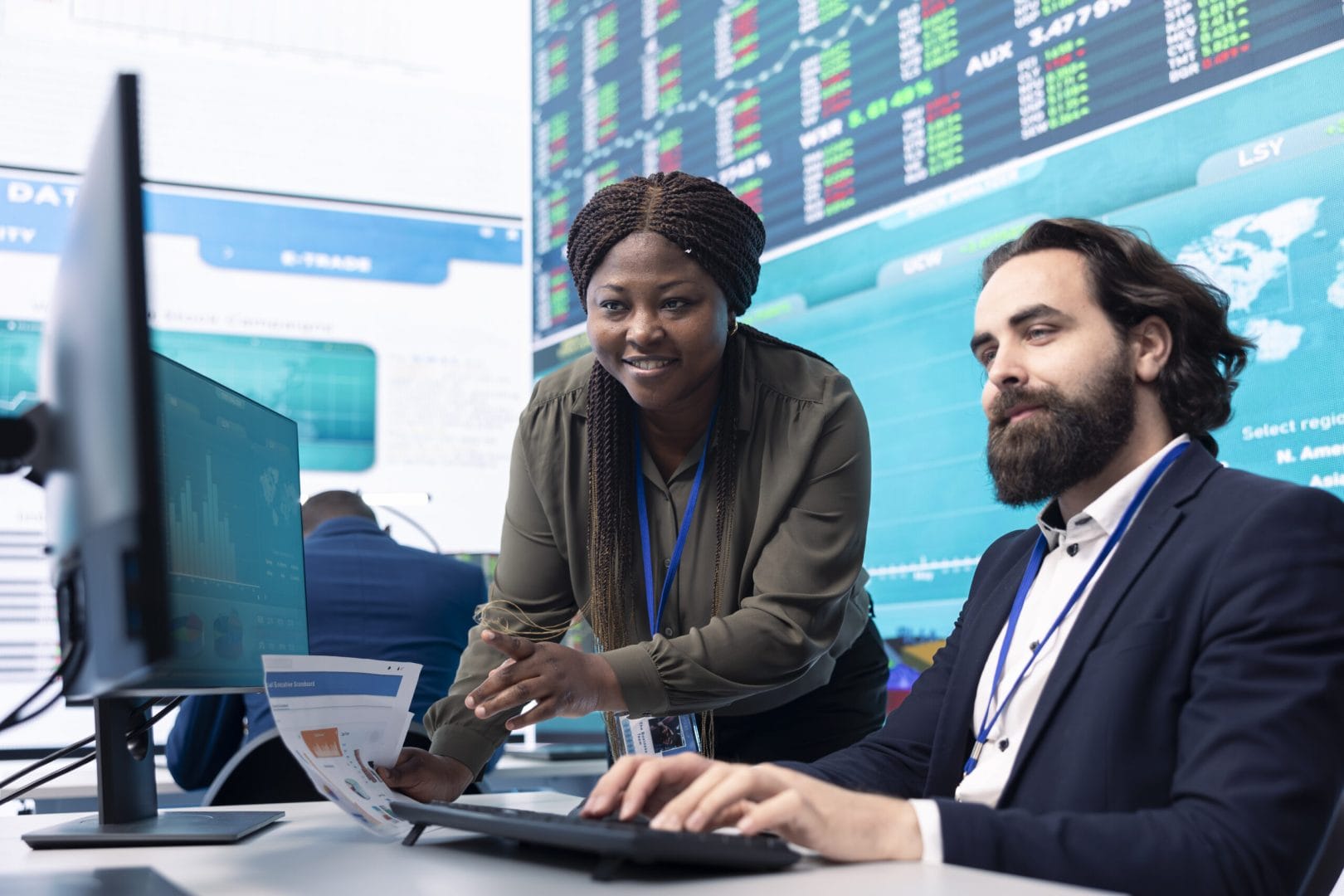 Team of diverse specialists review monthly cost and revenue elements