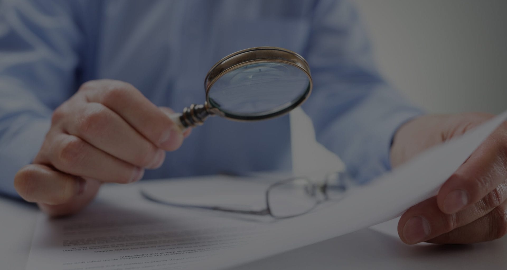 businessman-with-magnifying-glass-reading-overlay